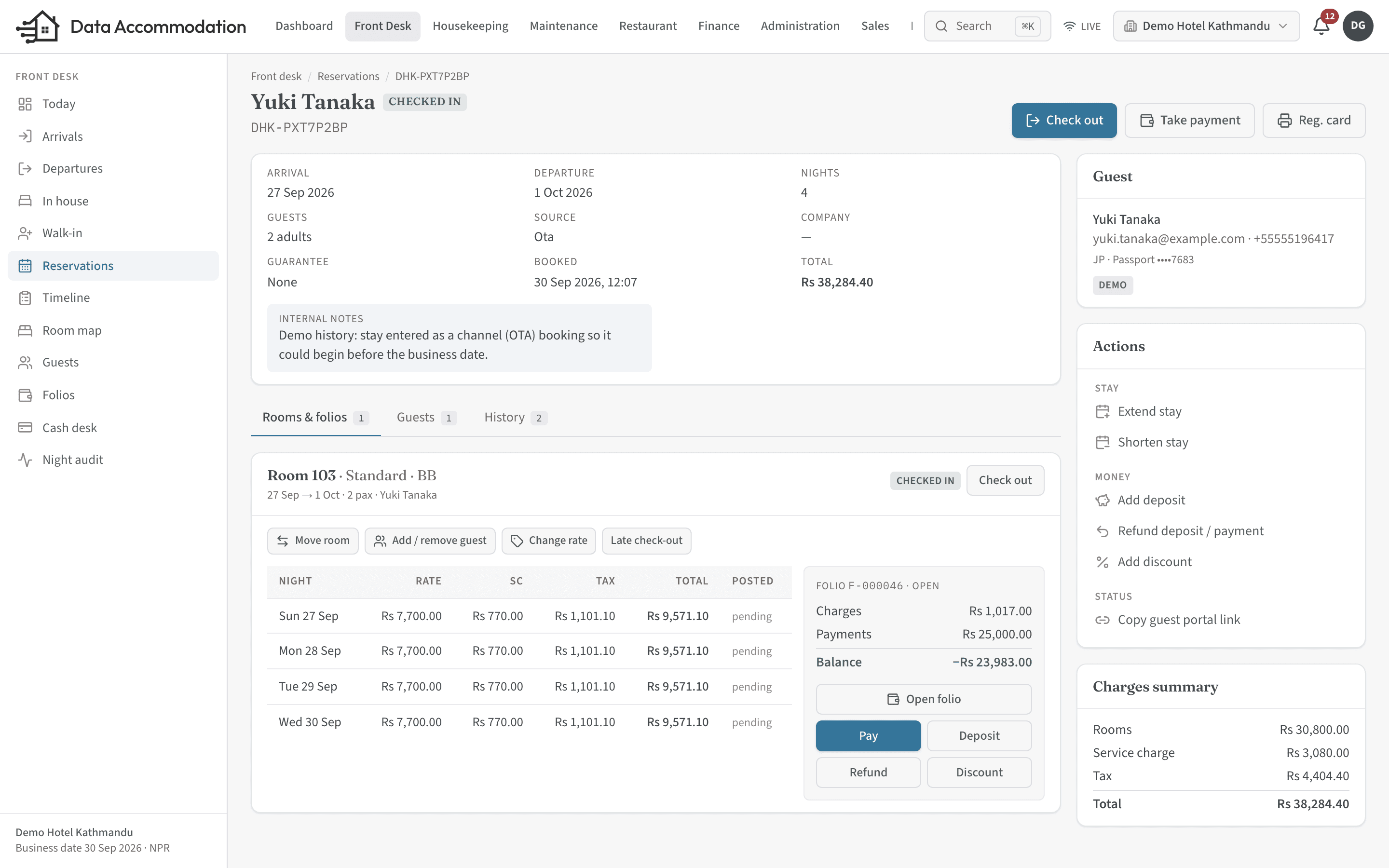 Reservation detail with room lines, guest, folio balance and actions