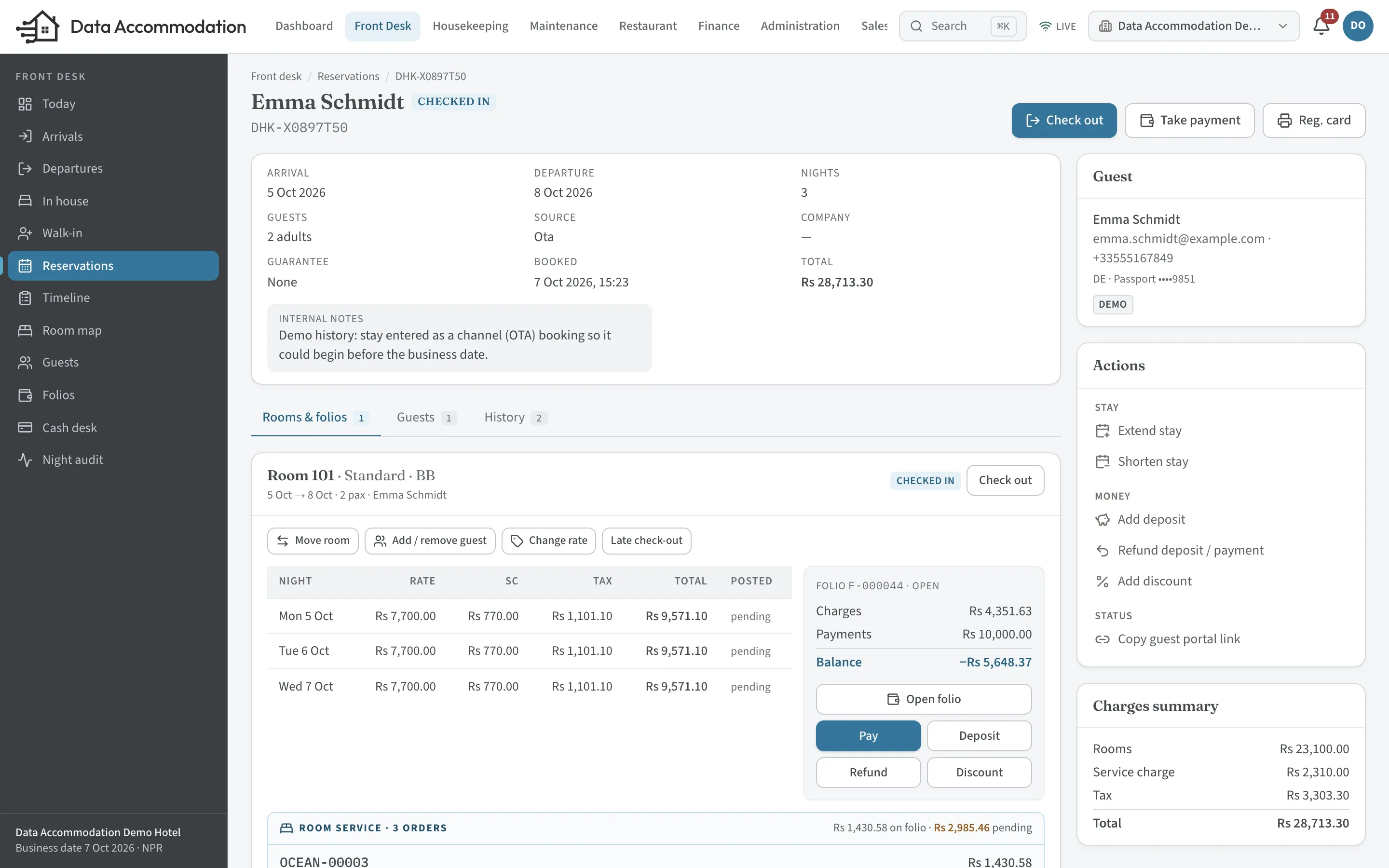 A reservation in the demo hotel: stay dates, nightly rates, guest card and the folio summary